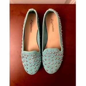 Zigi Soho blue/teal flats with silver spikes.